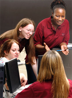 Rose Shumba, computer science professor, and students