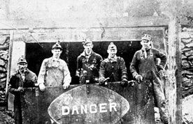 miner-with-danger-sign