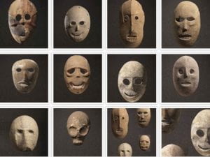 12 image of various stone masks with hollow eyes and no hair.  Each has different facial features and expressions. Most have teeth carved into the mouth