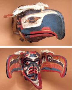 Red, white, and blue eagle head mask that opened in the center of the beak to reveal a human-like face of the same color pattern